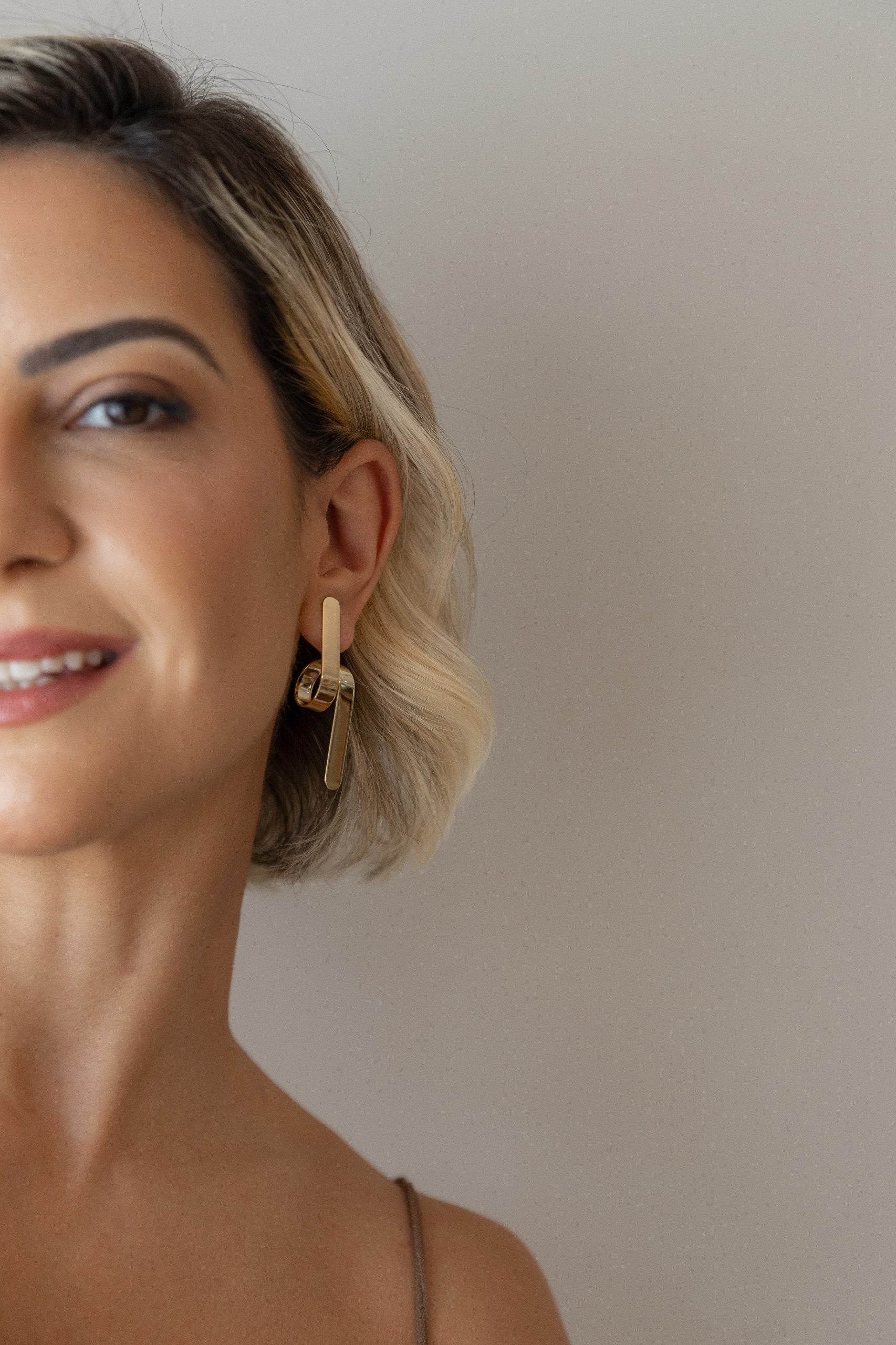 twisted earrings 18k gold plated. modern. stylish , sleek. feminine